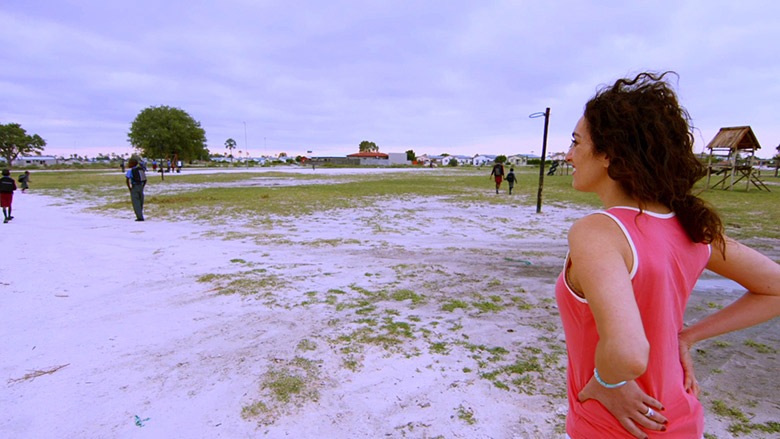 Amanda Martinez looking at the SOS Children playing