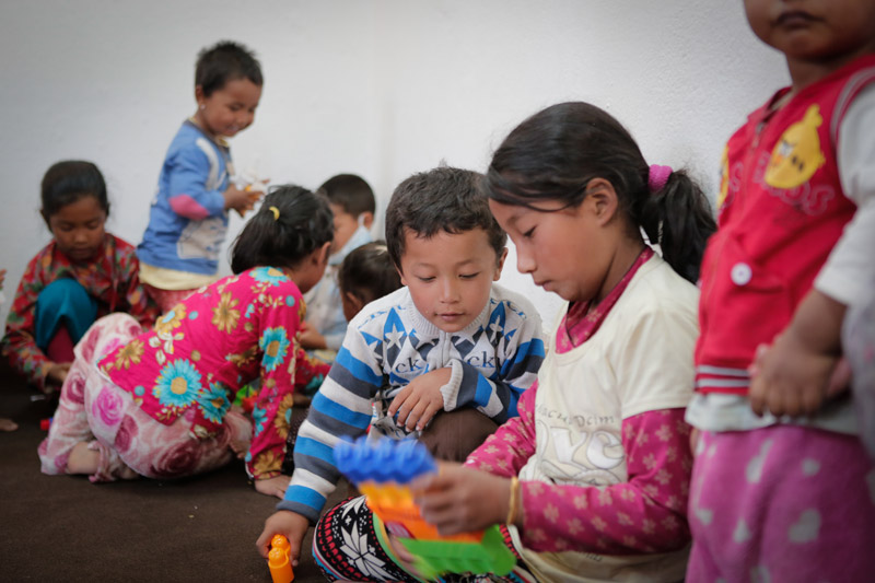 Ayesha and her brother in a SOS Child-Friently Space