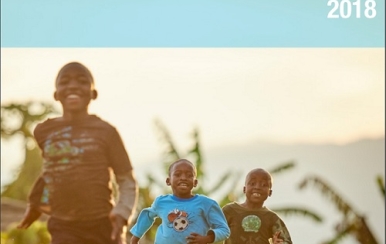 Children playing on the cover of 2018 annual report.