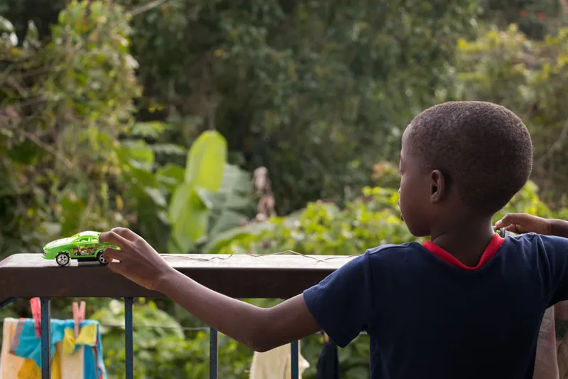 Boy with toy car in Stony Hill, Jamaica