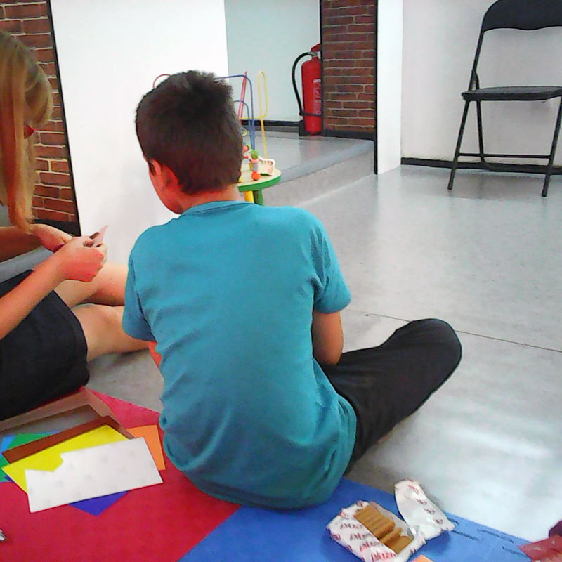 Syrian boy refugee playing with an SOS co-worker in Belgrade, Serbia