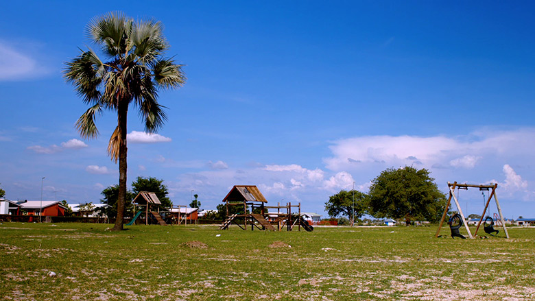 Playground in the SOS Village in Namibia with SOS homes in the background