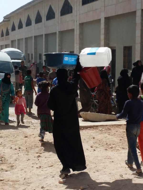 Woman with son carrying SOS emergency supplies