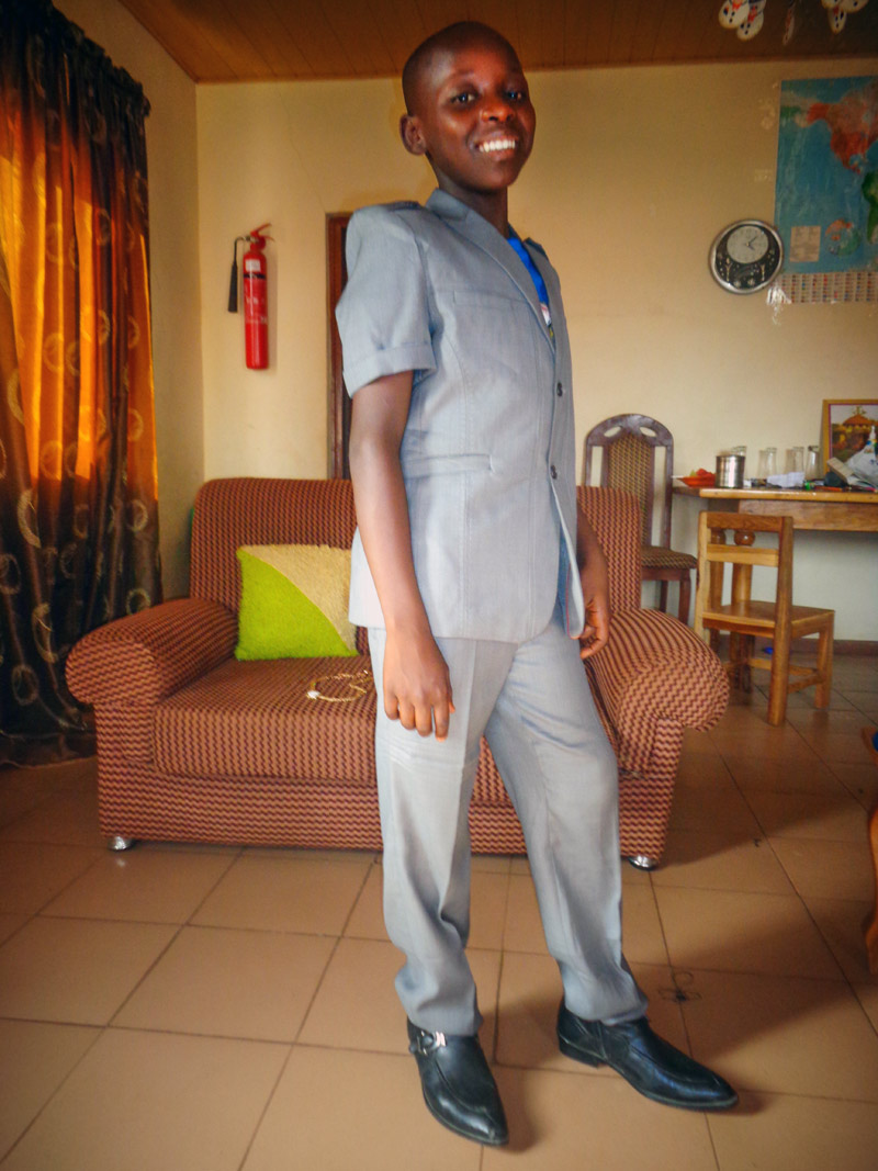 David in his best clothes in his home in Jos, Nigeria