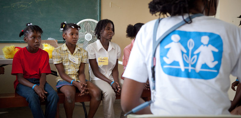 Youths and SOS co-worker/psychologist in a workshop about future after the Haiti earthquake